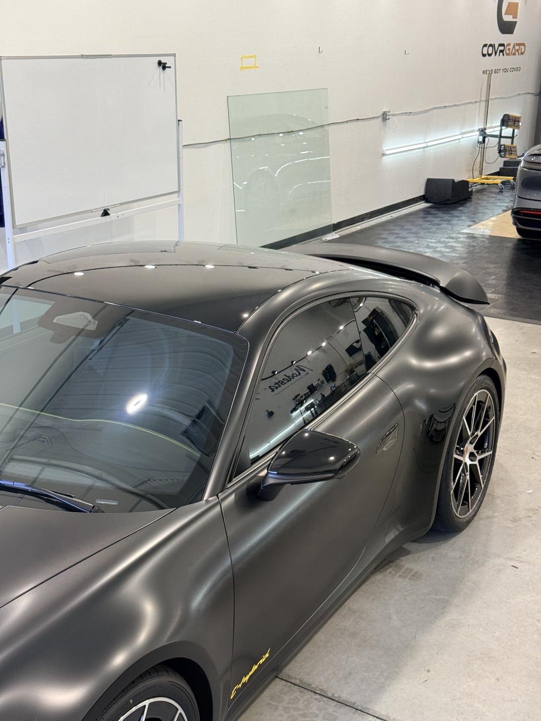Matte Porsche 911 with ceramic-tinted glass in the Taggart Films bay
