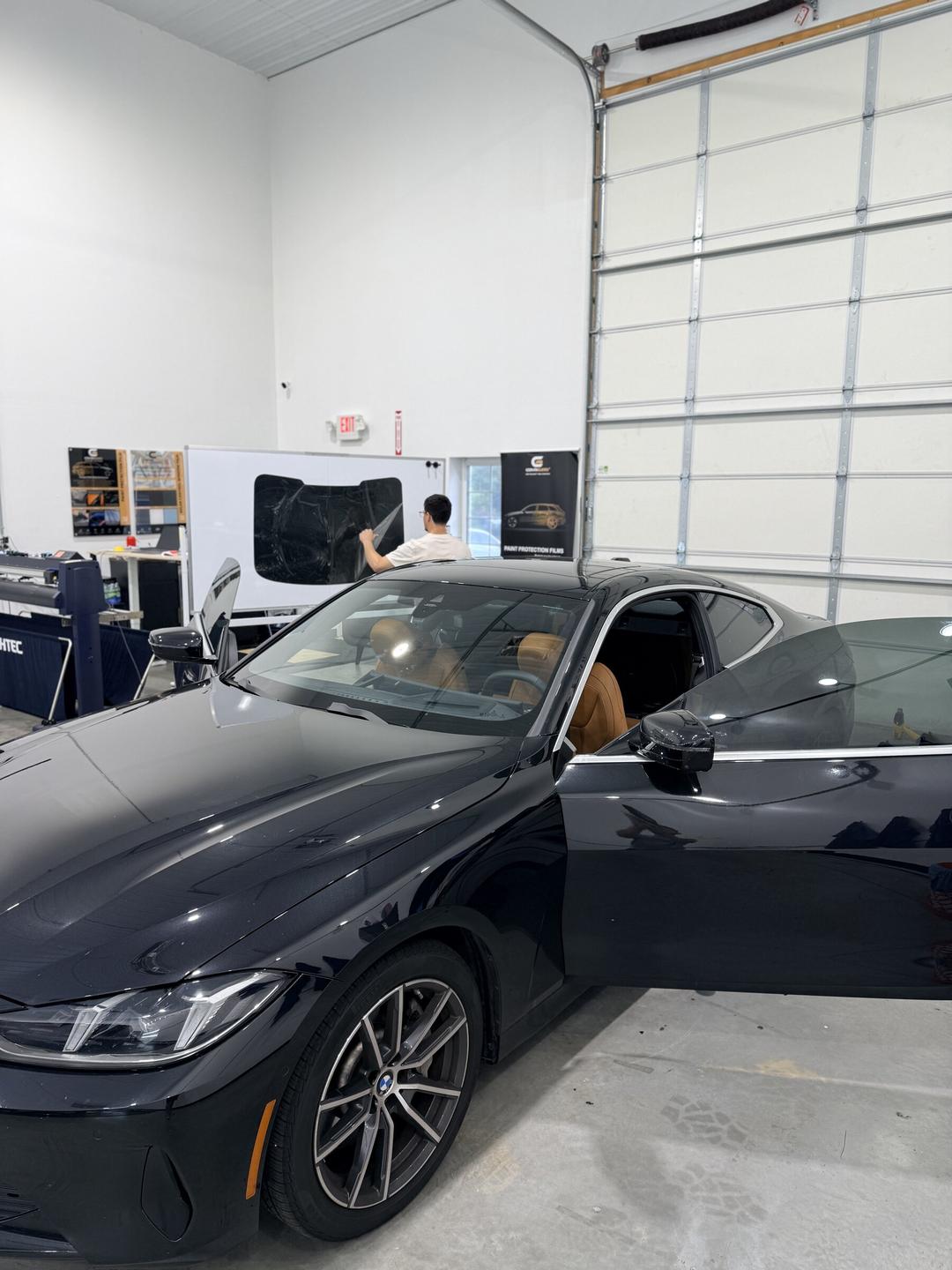 BMW in the Taggart Films bay while ceramic film is cut for the install